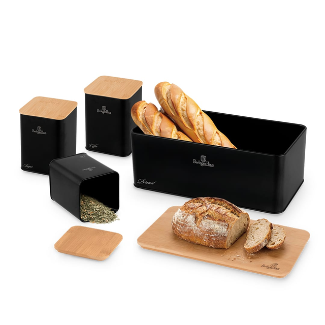 Berlinger Haus black bread storage set with bamboo lids and a loaf on a wooden cutting board; includes tall canisters and a bread box with baked baguettes inside.