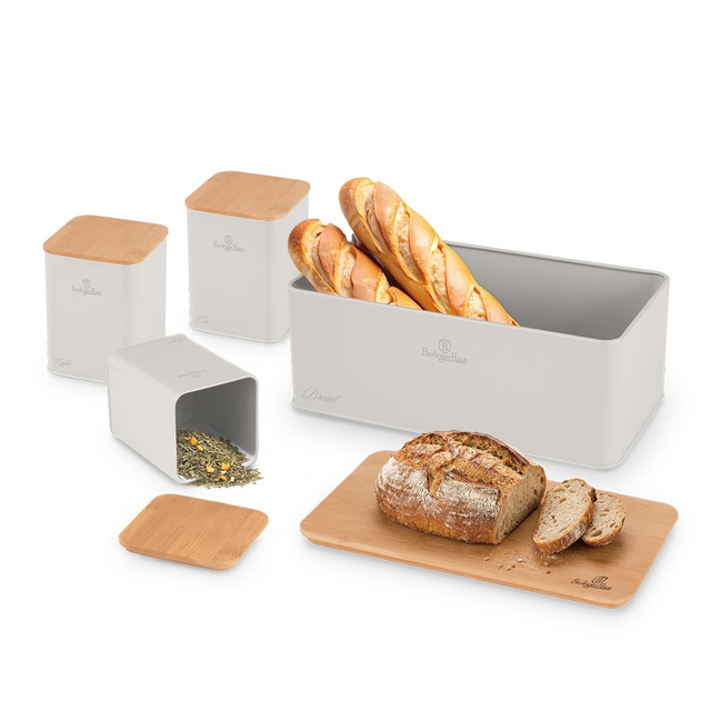 Set of white bread storage containers with bamboo lids, plus a wooden cutting board with a loaf and slices of bread.