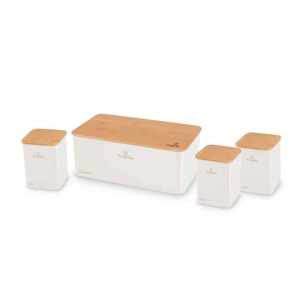 Set of white speakers with light wood tops arranged in a row, part of a home audio system.