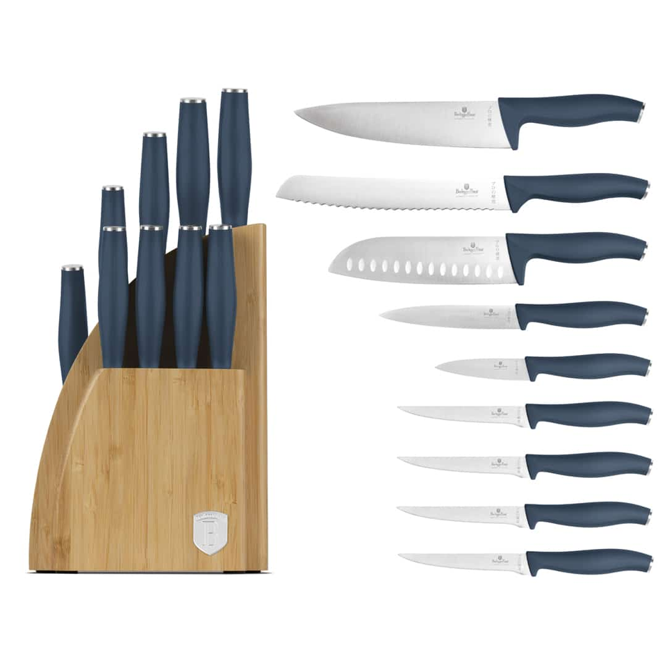 Wooden knife block filled with blue-handled kitchen knives; additional blue-handed blades laid out to the side.
