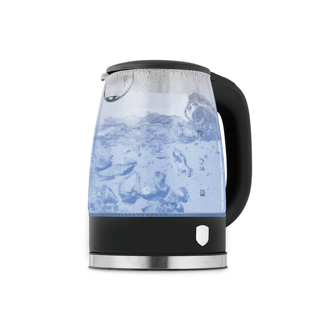 Electric kettle with a transparent body showing swirling hot water and droplets on the lid near the top edge.